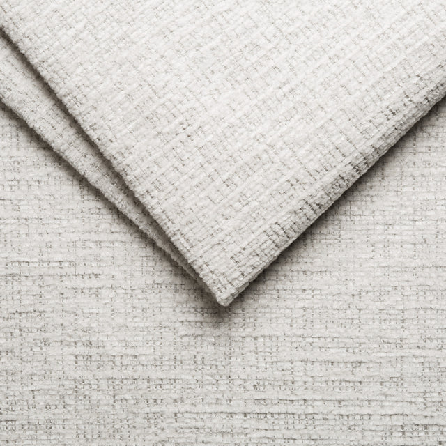 sofa modulaire en tissu givré greige, design contemporain sur fond blanc.