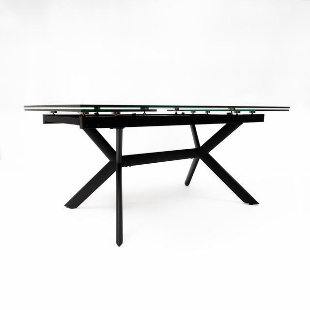 table extensible avec plateau effet marbre clair et pieds en metal noir.
