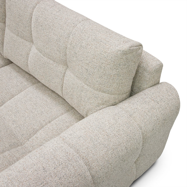 sofa modulaire en tissu terrazzo, design contemporain sur fond blanc.