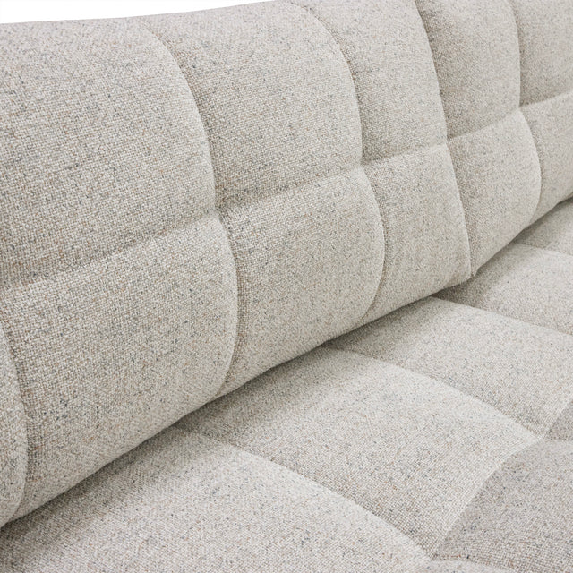 sofa modulaire en tissu terrazzo, design contemporain sur fond blanc.