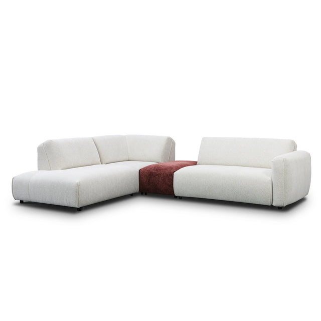 sofa modulaire en tissu crème marbré et tissu bordeau, au design contemporain sur un fond blanc.