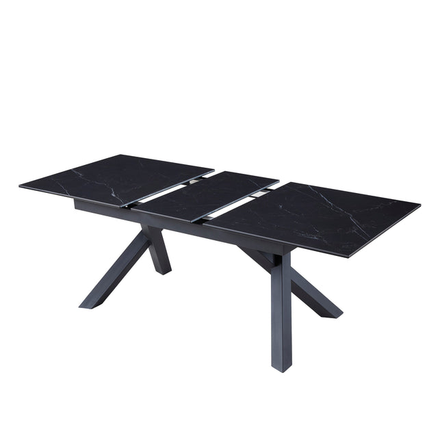 table de salle à manger extensible en céramique noire avec pattes angulaire sur fond blanc