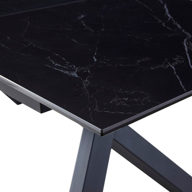 table de salle à manger extensible en céramique noire avec pattes angulaire sur fond blanc