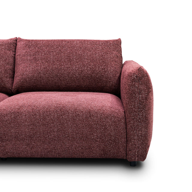 sofa modulaire en tissu bordeaux, design contemporain sur fond blanc.