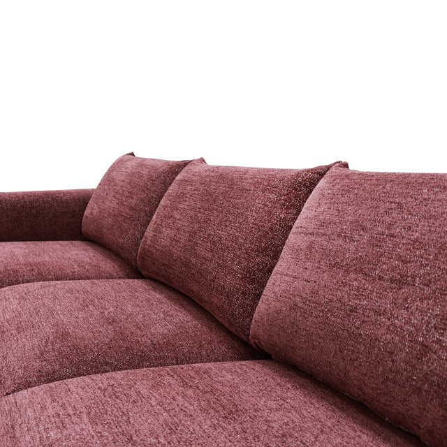 sofa modulaire en tissu bordeaux, design contemporain sur fond blanc.
