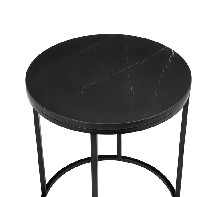 Plateau rond noir effet marbre avec veines blanches et structure metal noir elegante.