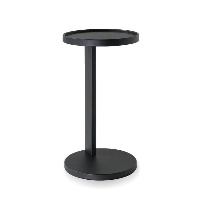 table d'appoint rond noir en metal au design minimaliste.
