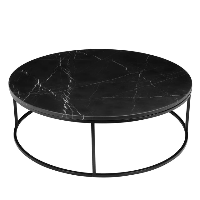 Table basse ronde noir effet marbre avec structure fine en metal noir moderne.