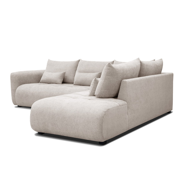 sofa modulaire en tissu sable fin, design contemporain sur fond blanc.