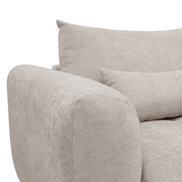 sofa modulaire en tissu sable fin, design contemporain sur fond blanc.
