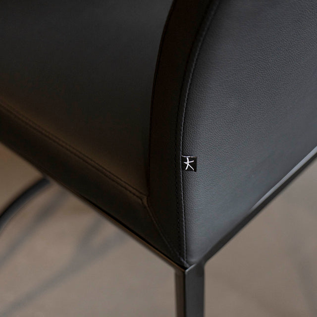 tabouret de comptoir noir en cuir synthetique avec dossier moderne et assise rembourrée