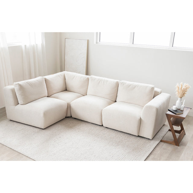 canape d angle beige clair en tissu boucle dans salon minimaliste et lumineux.