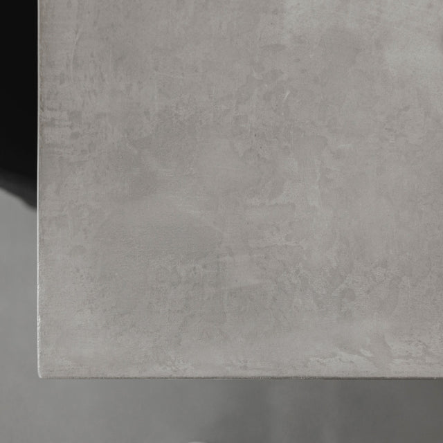 surface de table en beton gris avec texture naturelle et finition mate.
