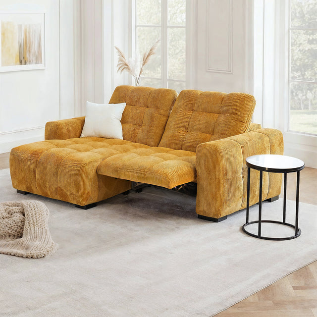 Canape relax jaune moutarde en velours cotele avec assise longue et coussin blanc.
