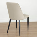 Chaise moderne taupe avec pieds noirs coniques, design elegant pour salle a manger.