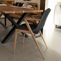 Chaise de salle a manger moderne en cuir végane noir avec accoudoirs et pieds en métal imitation bois