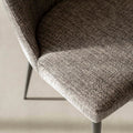 Chaise de salle a manger en tissu gris/brun moderne avec pattes en métal noir.