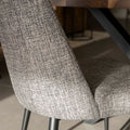 Chaise de salle a manger en tissu gris/brun moderne avec pattes en métal noir.