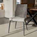Chaise de salle a manger en tissu gris/brun moderne avec pattes en métal noir.