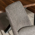 Chaise de salle a manger en tissu gris/brun moderne avec pattes en métal noir.