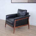 Fauteuil en cuir noir avec structure en bois style moderne.
