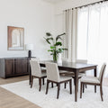 Table de salle à manger en bois foncé avec chaises rembourrées en tissu beige, style contemporain.