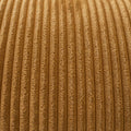 Sectionnel en velours côtelé camel, design moderne avec assise large dans un salon minimaliste.