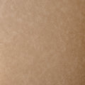 Ottoman rond en cuir végane mocha avec structure noire au style moderne et élégant.