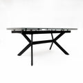 table extensible avec plateau effet marbre clair et pieds en metal noir.