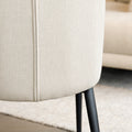 Chaise de salle à manger en tissu beige avec piètement noirs.