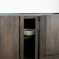 Buffet de rangement en bois foncé à quatre portes, design contemporain avec poignées intégrées et lignes épurées.