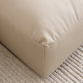 sofa modulaire en cuir beige.