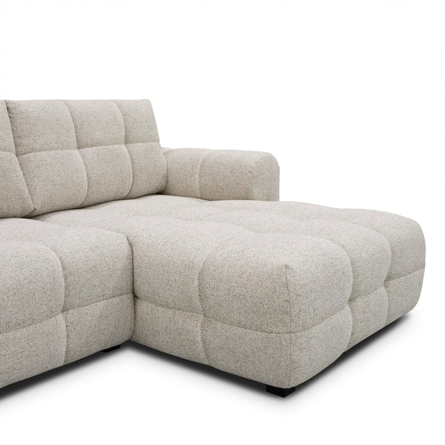 sofa modulaire en tissu terrazzo, design contemporain sur fond blanc.