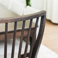 Chaise de salle à manger en bois foncé avec dossier à lattes et assise rembourrée en tissu beige.