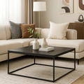 table basse moderne noire avec structure metal et plateau rectangulaire dans salon beige contemporain.

