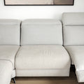 Sectionnel en tissu greige avec pattes noires, design moderne et assises confortables pour salon contemporain.