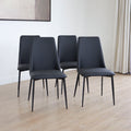 Ensemble de chaises noires modernes a pieds fins en metal.