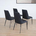 Ensemble de chaises noires modernes a pieds fins en metal.