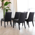 Ensemble de 5 chaises de cuisine SINATRA en cuir végane noir avec coutures assorties blanche avec les pattes en bois noir