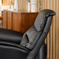Fauteuil en cuir noir avec appui-tête et base bois pivotante, dans un intérieur chaleureux.