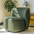 Fauteuil lounge vert en tissu bouclé avec base pivotante noire dans un salon moderne.