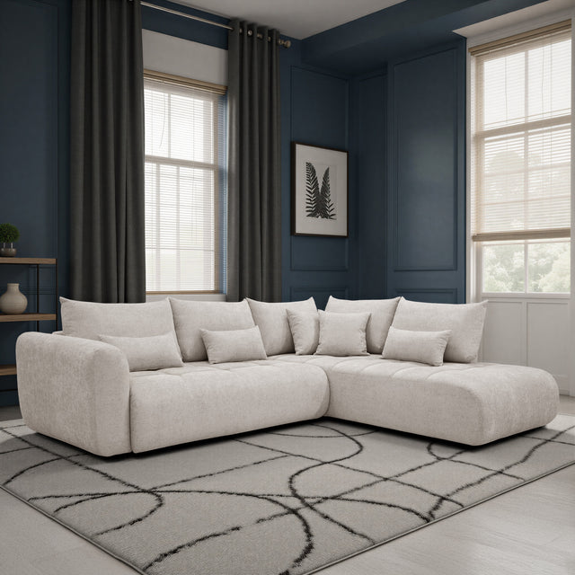 sofa modulaire en tissu sable fin, design contemporain, installé dans un salon unique et accueillant. 